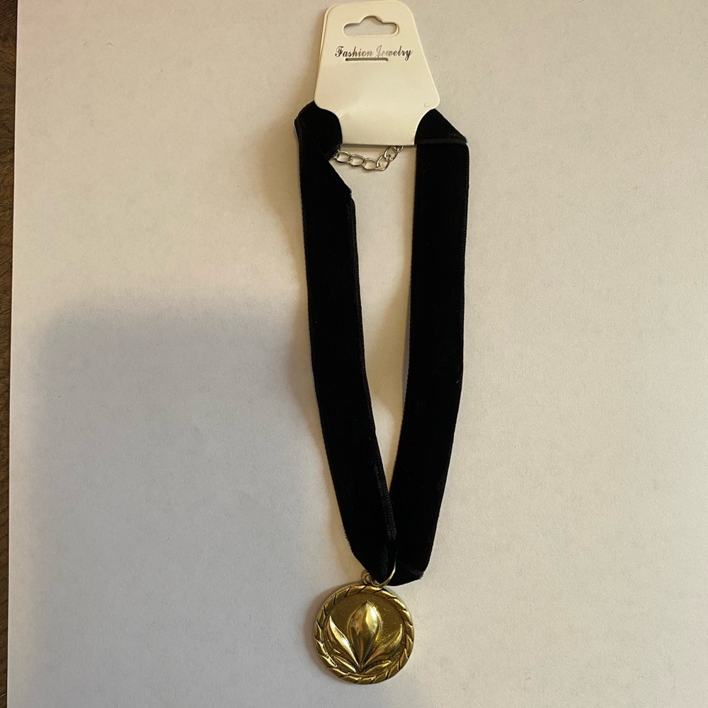 Black velvet necklace with gold pendant